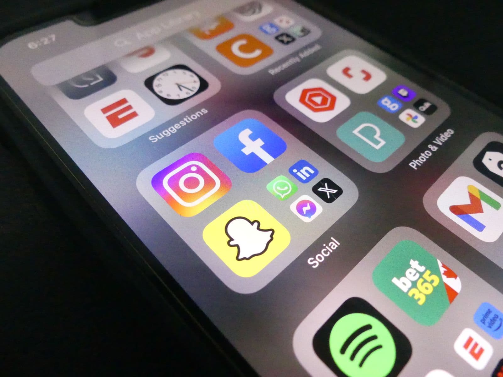 Smartphone home screen displaying rows of social media app icons