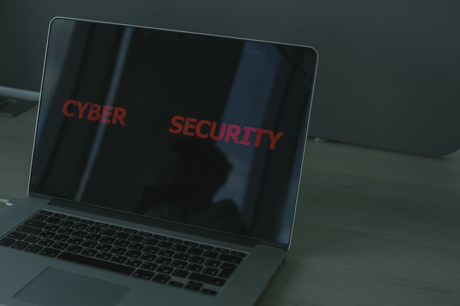 Laptop screen displaying cybersecurity related text