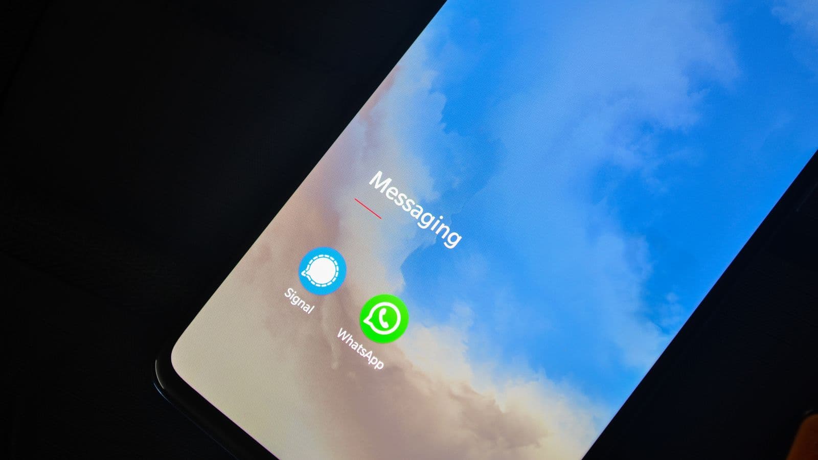 Close-up of a smartphone screen showing messaging app icons